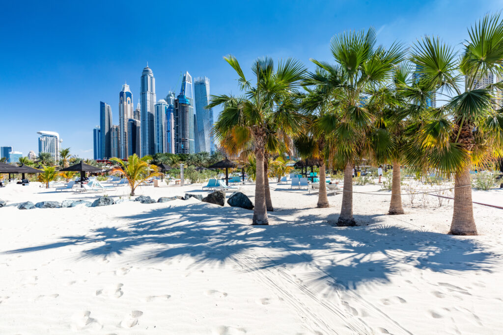 Dubai jumeirah beach with marina skyscrapers in UAE. Popular public JBR beach. Best Beach in Dubai